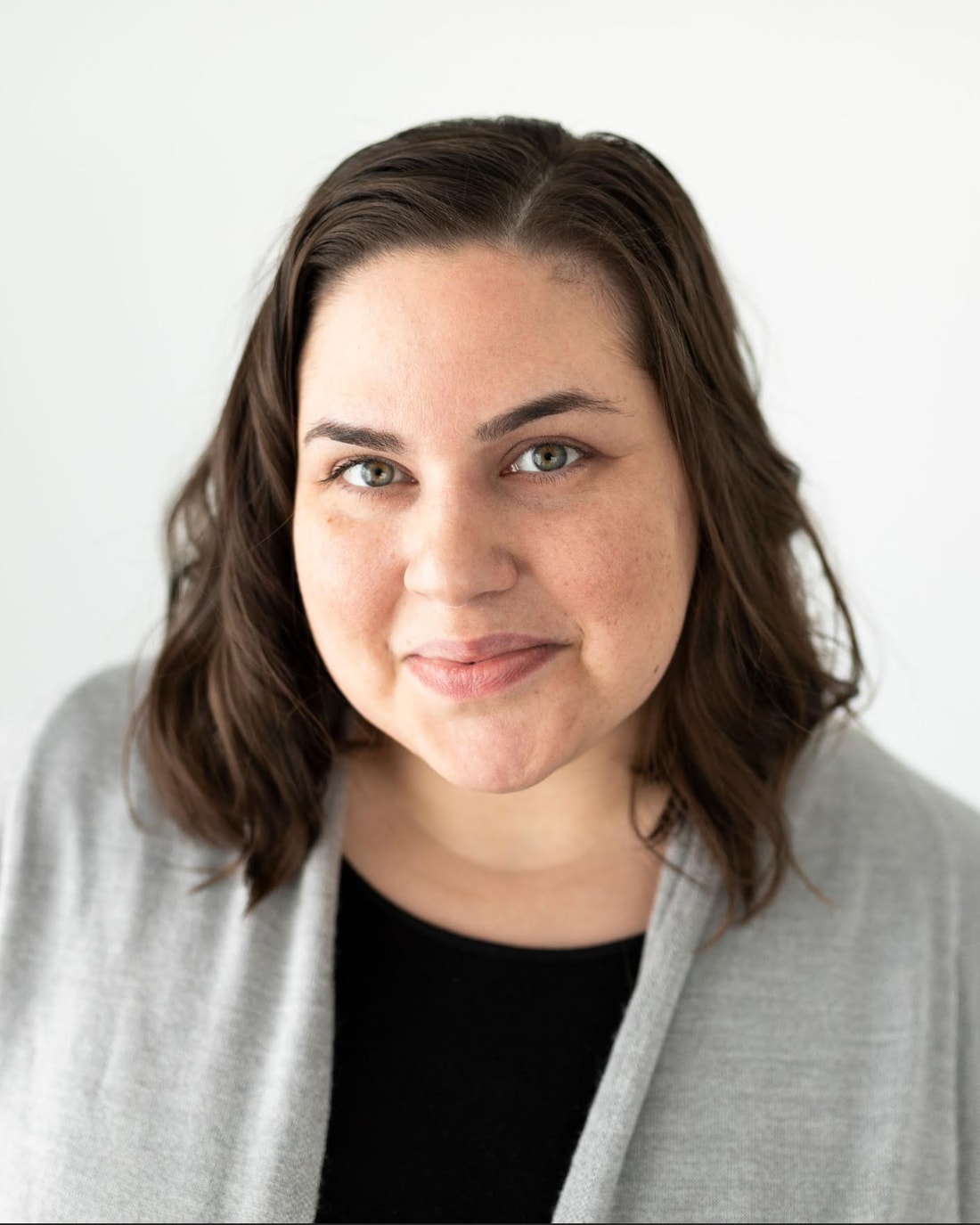 Kathryn Vuckovich, photographed against a plain light background.